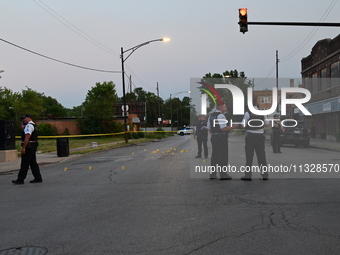 Over 29 evidence markers are being placed at the crime scene, highlighting where shell casings are being recovered by the Chicago police. A...