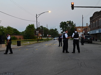 Over 29 evidence markers are being placed at the crime scene, highlighting where shell casings are being recovered by the Chicago police. A...