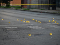 Over 29 evidence markers are being placed at the crime scene, highlighting where shell casings are being recovered by the Chicago police. A...