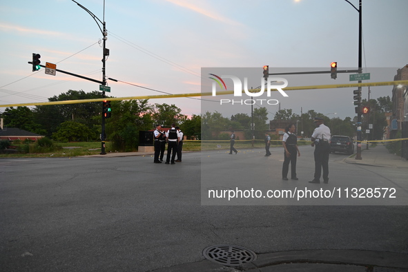 Over 29 evidence markers are being placed at the crime scene, highlighting where shell casings are being recovered by the Chicago police. A...