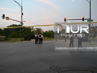 Over 29 evidence markers are being placed at the crime scene, highlighting where shell casings are being recovered by the Chicago police. A...