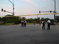 Over 29 evidence markers are being placed at the crime scene, highlighting where shell casings are being recovered by the Chicago police. A...