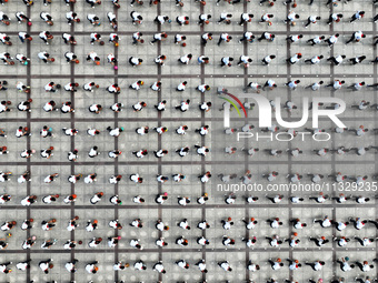 Primary school students are demonstrating basketball exercises at a school in Suqian, Jiangsu province, China, on June 14, 2024. (