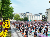 Primary school students are demonstrating basketball exercises at a school in Suqian, Jiangsu province, China, on June 14, 2024. (