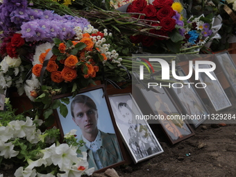 Photographs and flowers are being pictured at the grave of Ukrainian serviceman, artist, musician, stylist, and queer community member Artur...