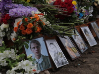 Photographs and flowers are being pictured at the grave of Ukrainian serviceman, artist, musician, stylist, and queer community member Artur...