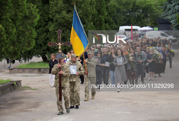 The funeral procession of Ukrainian serviceman, artist, musician, stylist, and queer community member Artur Snitkus, 36, who perished in act...