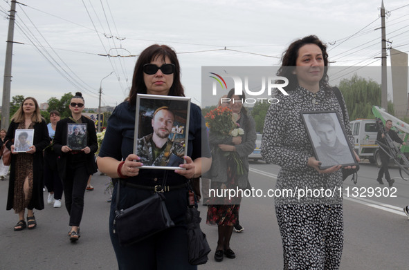 The funeral procession of Ukrainian serviceman, artist, musician, stylist, and queer community member Artur Snitkus, 36, who perished in act...