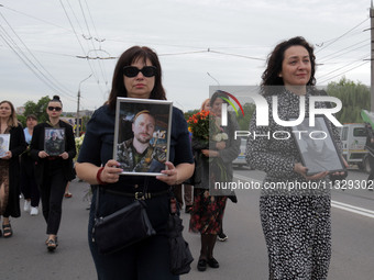 The funeral procession of Ukrainian serviceman, artist, musician, stylist, and queer community member Artur Snitkus, 36, who perished in act...