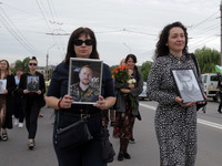 The funeral procession of Ukrainian serviceman, artist, musician, stylist, and queer community member Artur Snitkus, 36, who perished in act...