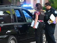 Chicago police are searching a vehicle damaged by bullet holes at the scene of the mass shooting. Four people are being shot in a mass shoot...