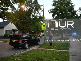 Chicago police are searching a vehicle damaged by bullet holes at the scene of the mass shooting. Four people are being shot in a mass shoot...