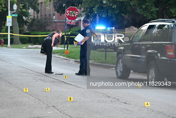 Chicago police are searching a vehicle damaged by bullet holes at the scene of the mass shooting. Four people are being shot in a mass shoot...