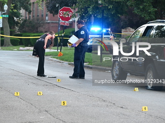 Chicago police are searching a vehicle damaged by bullet holes at the scene of the mass shooting. Four people are being shot in a mass shoot...