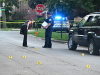 Chicago police are searching a vehicle damaged by bullet holes at the scene of the mass shooting. Four people are being shot in a mass shoot...