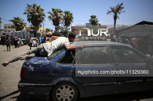 An injured youth is being brought to the al-Aqsa Martyrs Hospital in Deir al-Balah, in the central Gaza Strip, following the Israeli bombard...