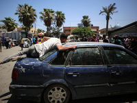 An injured youth is being brought to the al-Aqsa Martyrs Hospital in Deir al-Balah, in the central Gaza Strip, following the Israeli bombard...