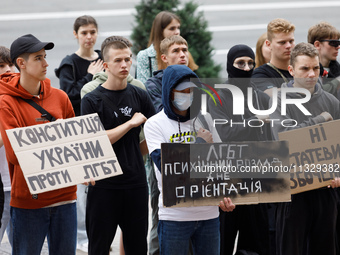 Demonstrators are holding a protest action outside the Kyiv City State Administration against the LGBT community to call for the cancellatio...