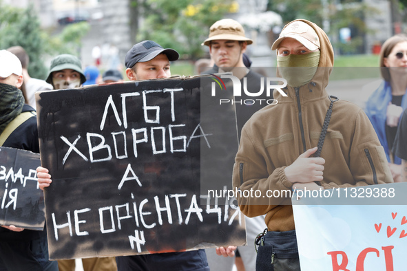 Demonstrators are holding a protest action outside the Kyiv City State Administration against the LGBT community to call for the cancellatio...