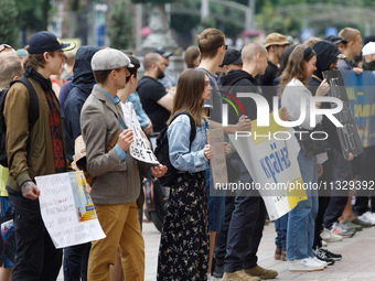 Demonstrators are holding a protest action outside the Kyiv City State Administration against the LGBT community to call for the cancellatio...