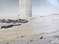 A view of the Teesta River as the waters are entering the roads and houses due to the risen water level of the river, which is flowing besid...