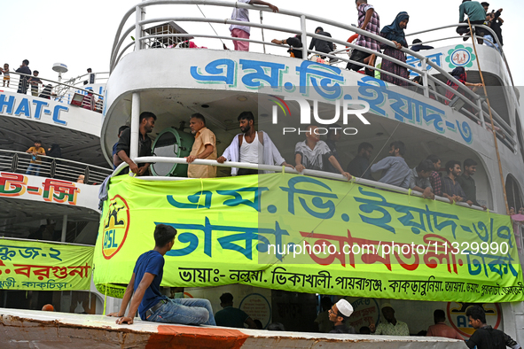 Passengers are gathering at the launch terminal for ferries as they are traveling back to their villages from the capital Dhaka to celebrate...