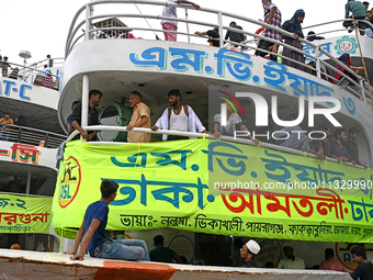 Passengers are gathering at the launch terminal for ferries as they are traveling back to their villages from the capital Dhaka to celebrate...