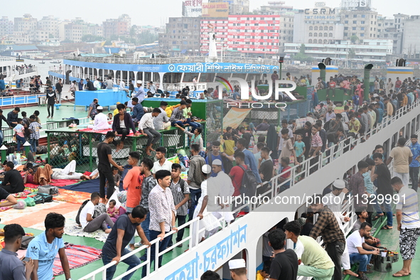 Passengers are gathering at the launch terminal for ferries as they are traveling back to their villages from the capital Dhaka to celebrate...