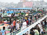 Passengers are gathering at the launch terminal for ferries as they are traveling back to their villages from the capital Dhaka to celebrate...