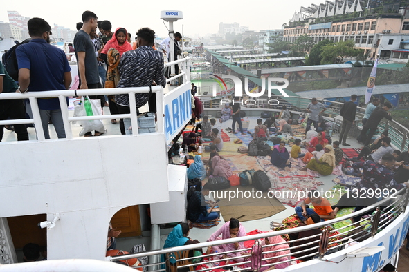 Passengers are gathering at the launch terminal for ferries as they are traveling back to their villages from the capital Dhaka to celebrate...