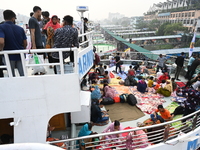 Passengers are gathering at the launch terminal for ferries as they are traveling back to their villages from the capital Dhaka to celebrate...