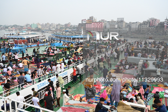 Passengers are gathering at the launch terminal for ferries as they are traveling back to their villages from the capital Dhaka to celebrate...