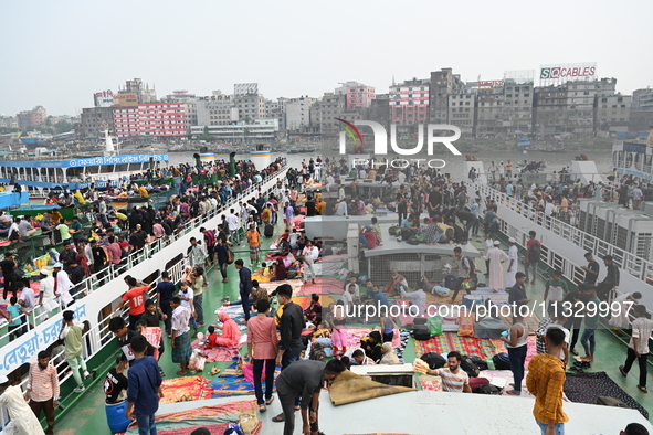 Passengers are gathering at the launch terminal for ferries as they are traveling back to their villages from the capital Dhaka to celebrate...