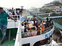 Passengers are gathering at the launch terminal for ferries as they are traveling back to their villages from the capital Dhaka to celebrate...