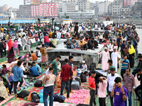 Passengers are gathering at the launch terminal for ferries as they are traveling back to their villages from the capital Dhaka to celebrate...