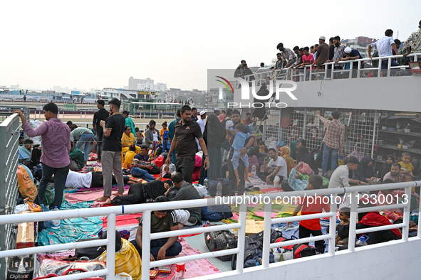 Passengers are gathering at the launch terminal for ferries as they are traveling back to their villages from the capital Dhaka to celebrate...