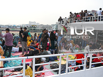 Passengers are gathering at the launch terminal for ferries as they are traveling back to their villages from the capital Dhaka to celebrate...