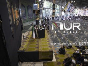 Leader of Tehran's Friday prayers, Ahmad Khatami (C), is delivering a sermon during prayer ceremonies at the University of Tehran, amidst th...