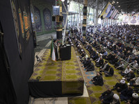 Leader of Tehran's Friday prayers, Ahmad Khatami (C), is delivering a sermon during prayer ceremonies at the University of Tehran, amidst th...