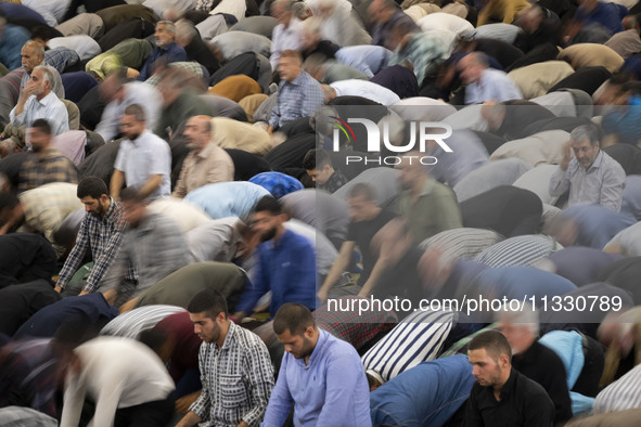 Iranian worshippers are praying during Friday prayers ceremonies at the University of Tehran, amidst the early presidential election campaig...