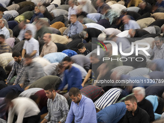 Iranian worshippers are praying during Friday prayers ceremonies at the University of Tehran, amidst the early presidential election campaig...