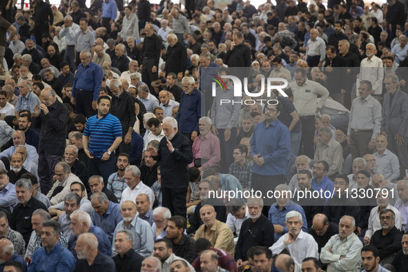 Iranian worshippers are preparing to pray during Friday prayer ceremonies at the University of Tehran, in Tehran, Iran, on June 14, 2024, am...