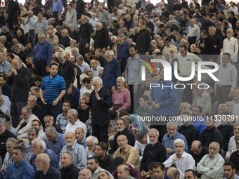 Iranian worshippers are preparing to pray during Friday prayer ceremonies at the University of Tehran, in Tehran, Iran, on June 14, 2024, am...