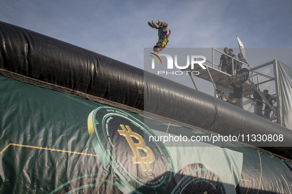 A young Iranian diver is jumping during a street diving event organized and held by Tehran's Adrenaline Park, in a recreation area in wester...