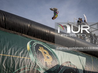 A young Iranian diver is jumping during a street diving event organized and held by Tehran's Adrenaline Park, in a recreation area in wester...