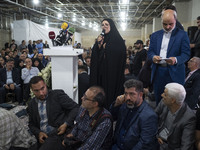 Farideh Oladghobad (C), a former reformist female member of parliament, is delivering speeches while participating in an electoral campaign...