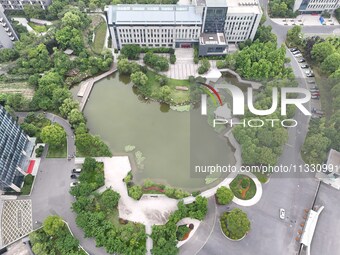 A lake shaped like a map of China is being seen at a university in Hangzhou, Zhejiang province, China, on June 14, 2024. (