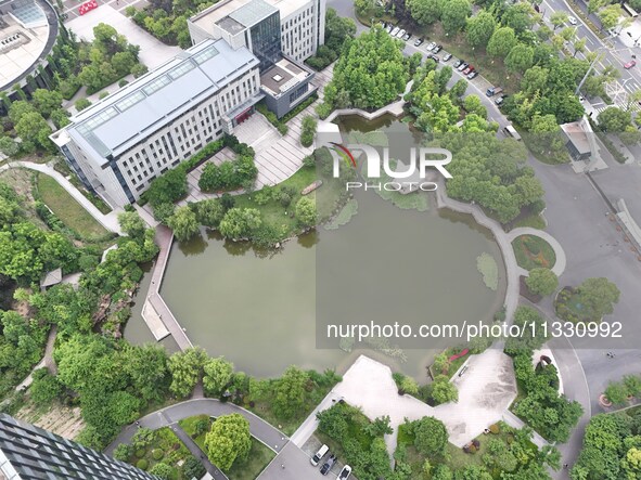 A lake shaped like a map of China is being seen at a university in Hangzhou, Zhejiang province, China, on June 14, 2024. 