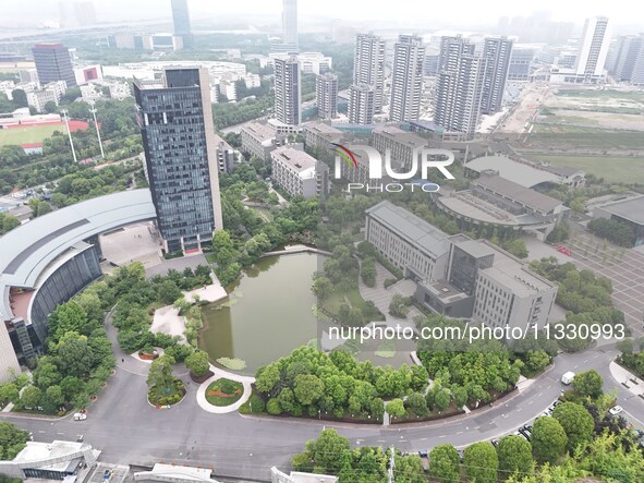 A lake shaped like a map of China is being seen at a university in Hangzhou, Zhejiang province, China, on June 14, 2024. 