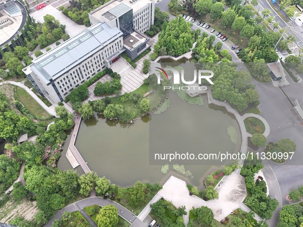 A lake shaped like a map of China is being seen at a university in Hangzhou, Zhejiang province, China, on June 14, 2024. 